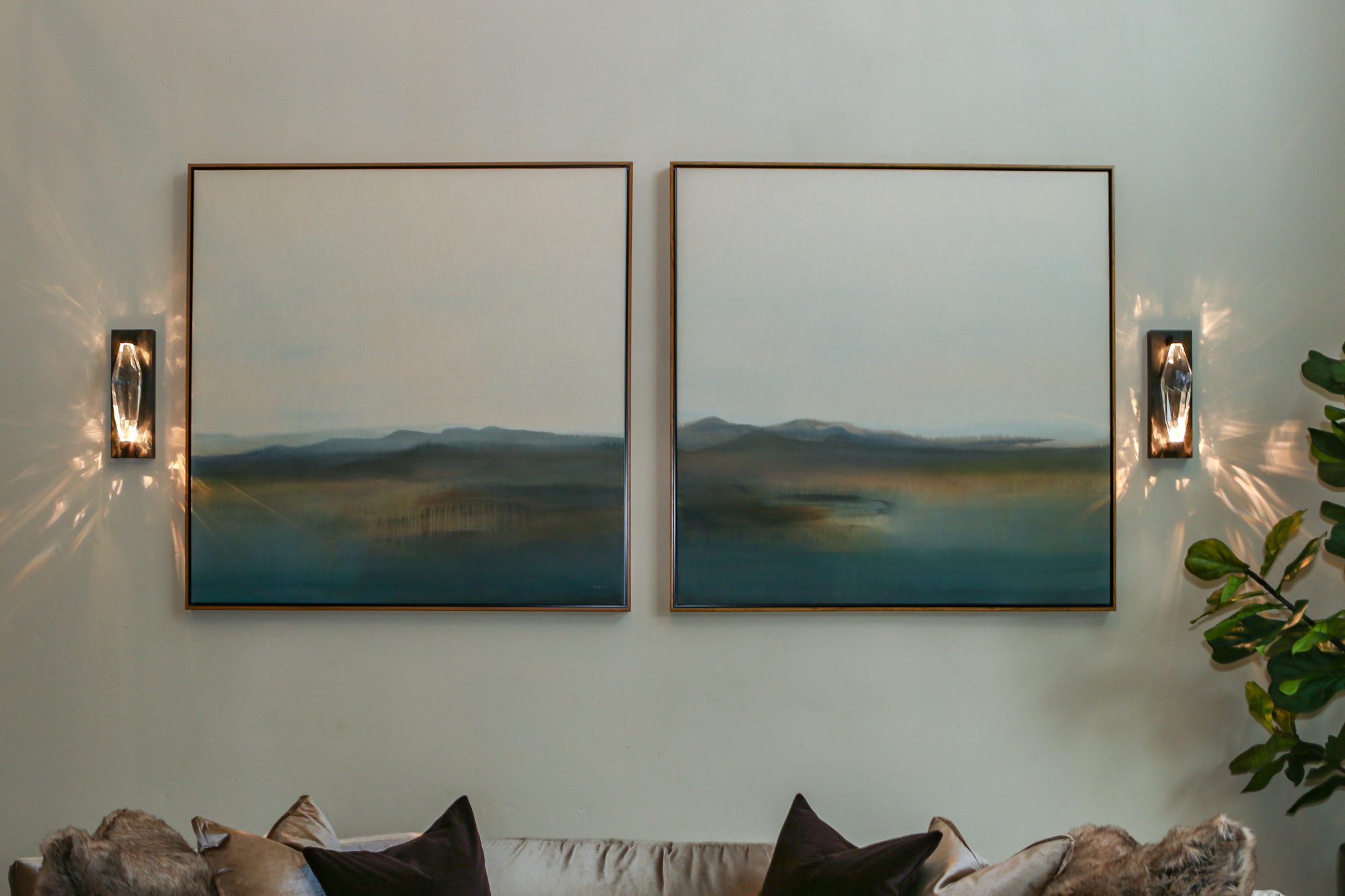 Modern living room design with abstract landscape paintings and stylish lighting in Lincoln, CA