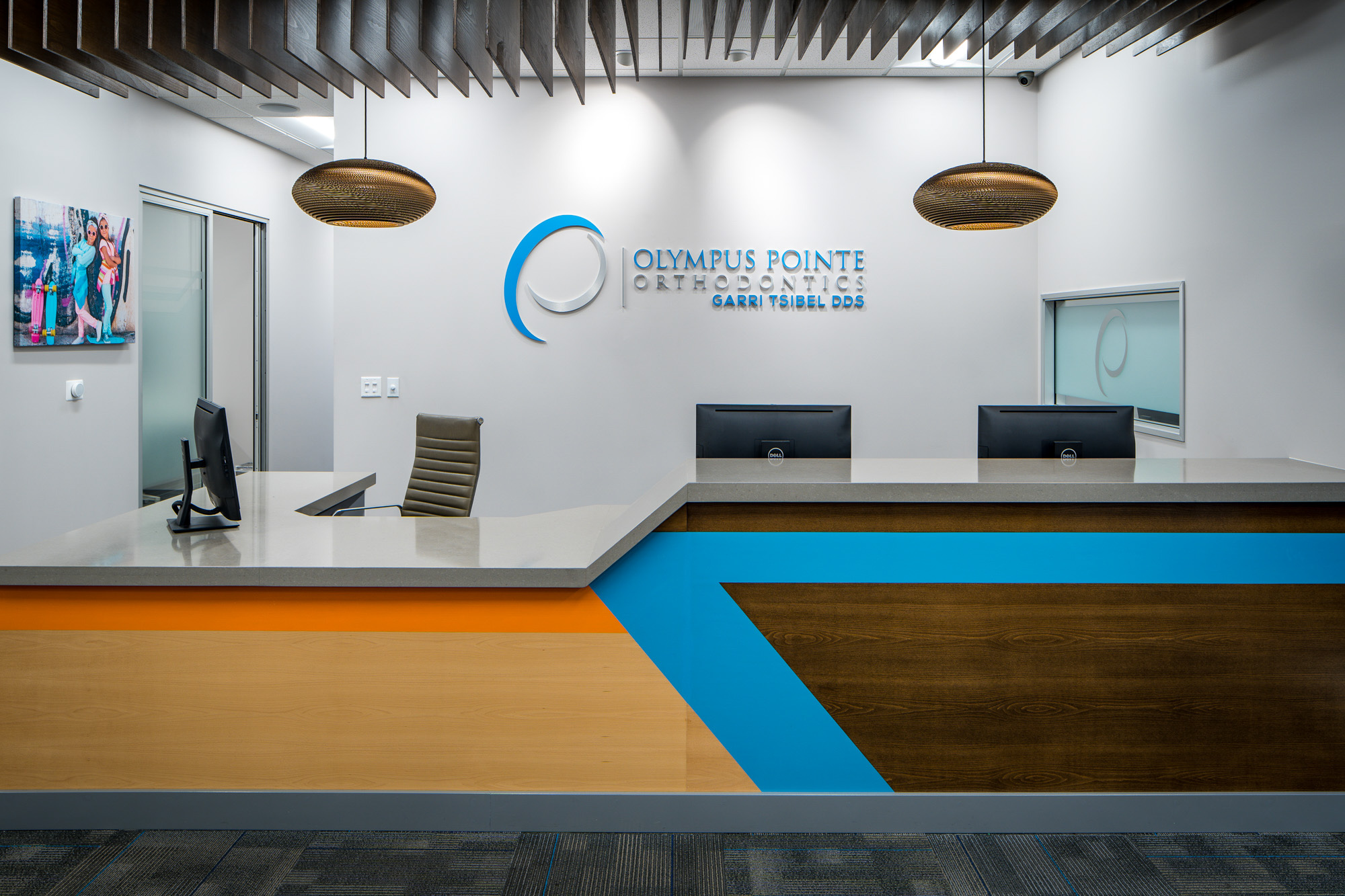 Modern dental office reception with sleek design and colorful accent details in Roseville, CA.