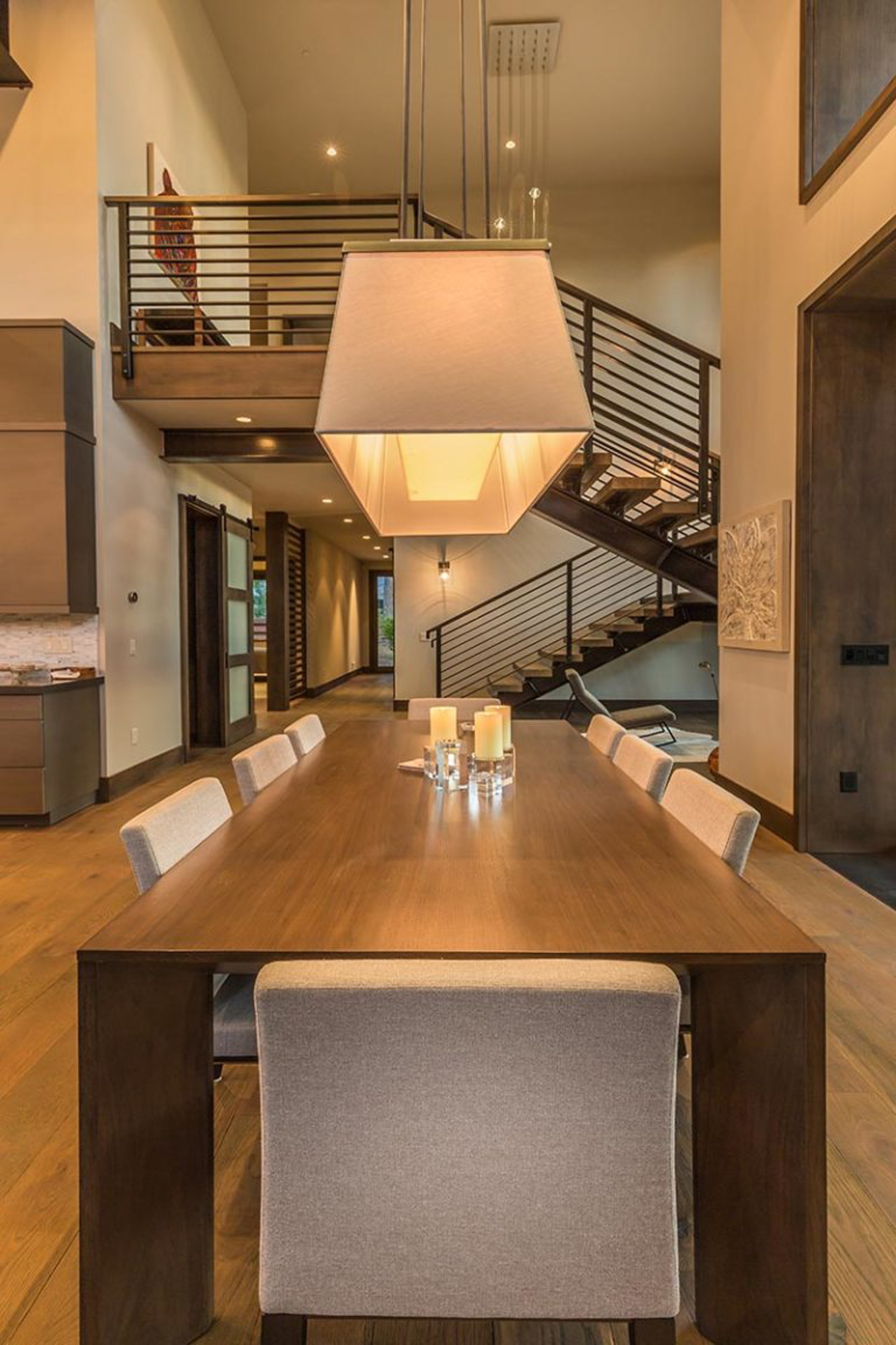 Modern dining room featuring a long wooden table and stylish chairs, located in Martis Camp, Truckee, CA.
