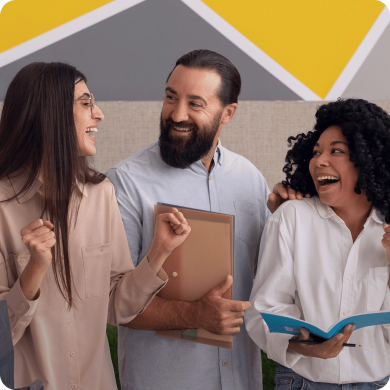 Excited nonprofit professionals celebrating successful fundraising campaign results