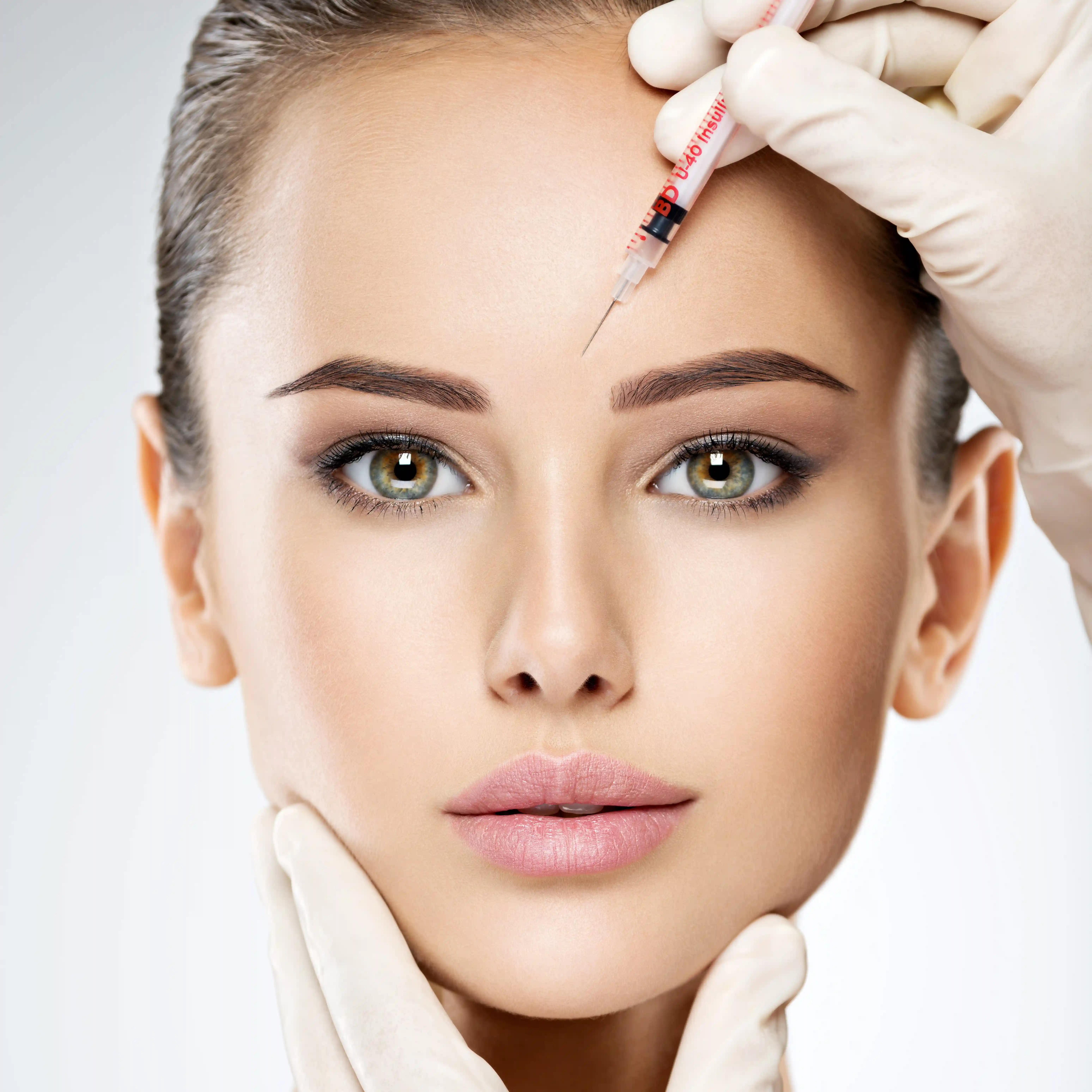 Beautiful woman getting Botox injections.