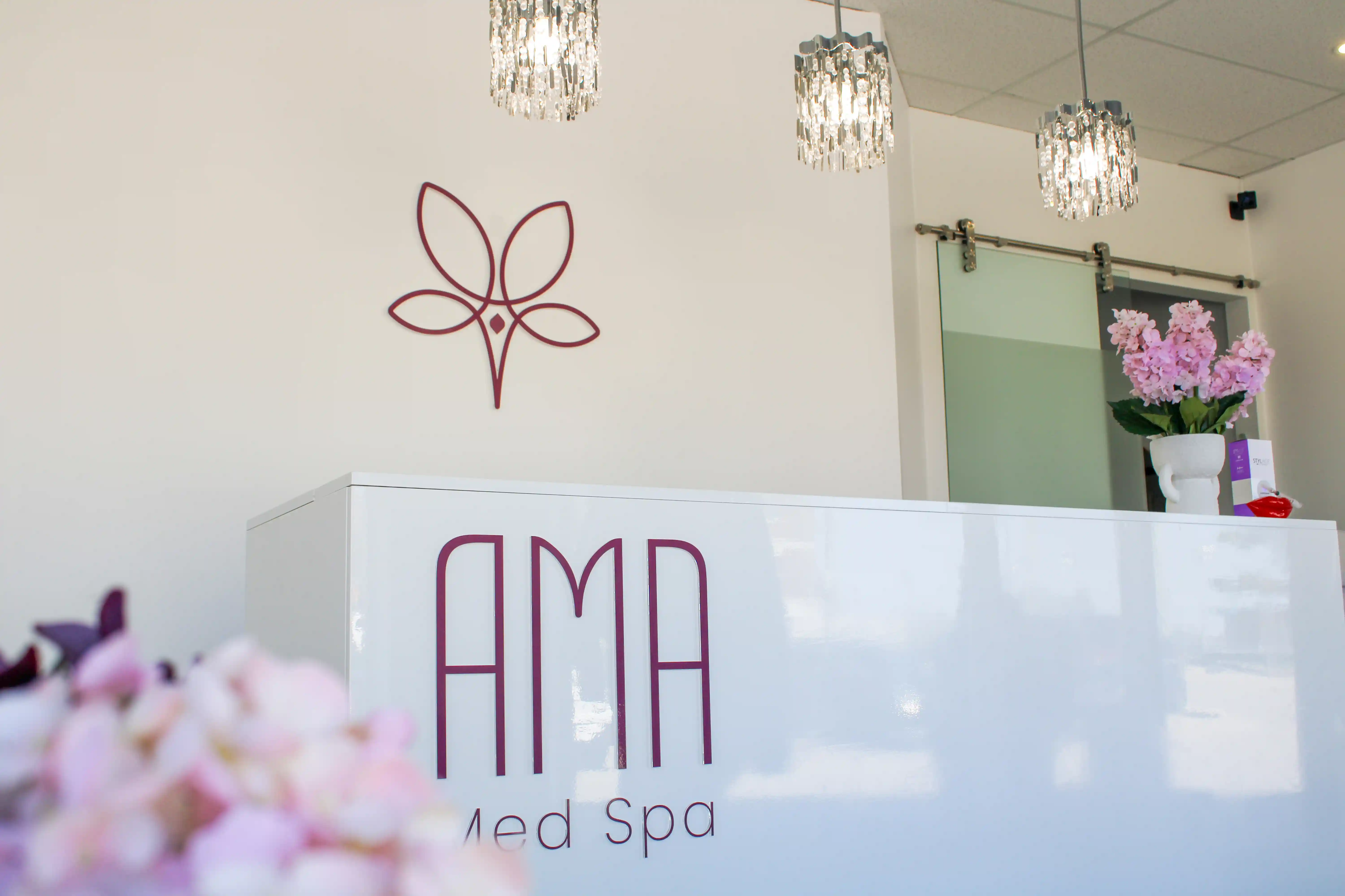 AMA Med Spa reception desk with Logo and Wordmark signage.