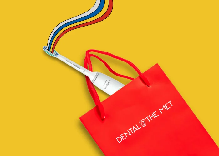 Gift bag with Sonicare electric toothbrush.
