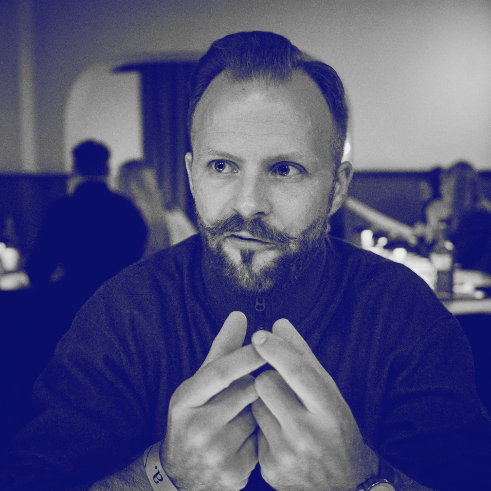 Sean Loomis Sitting at a Table