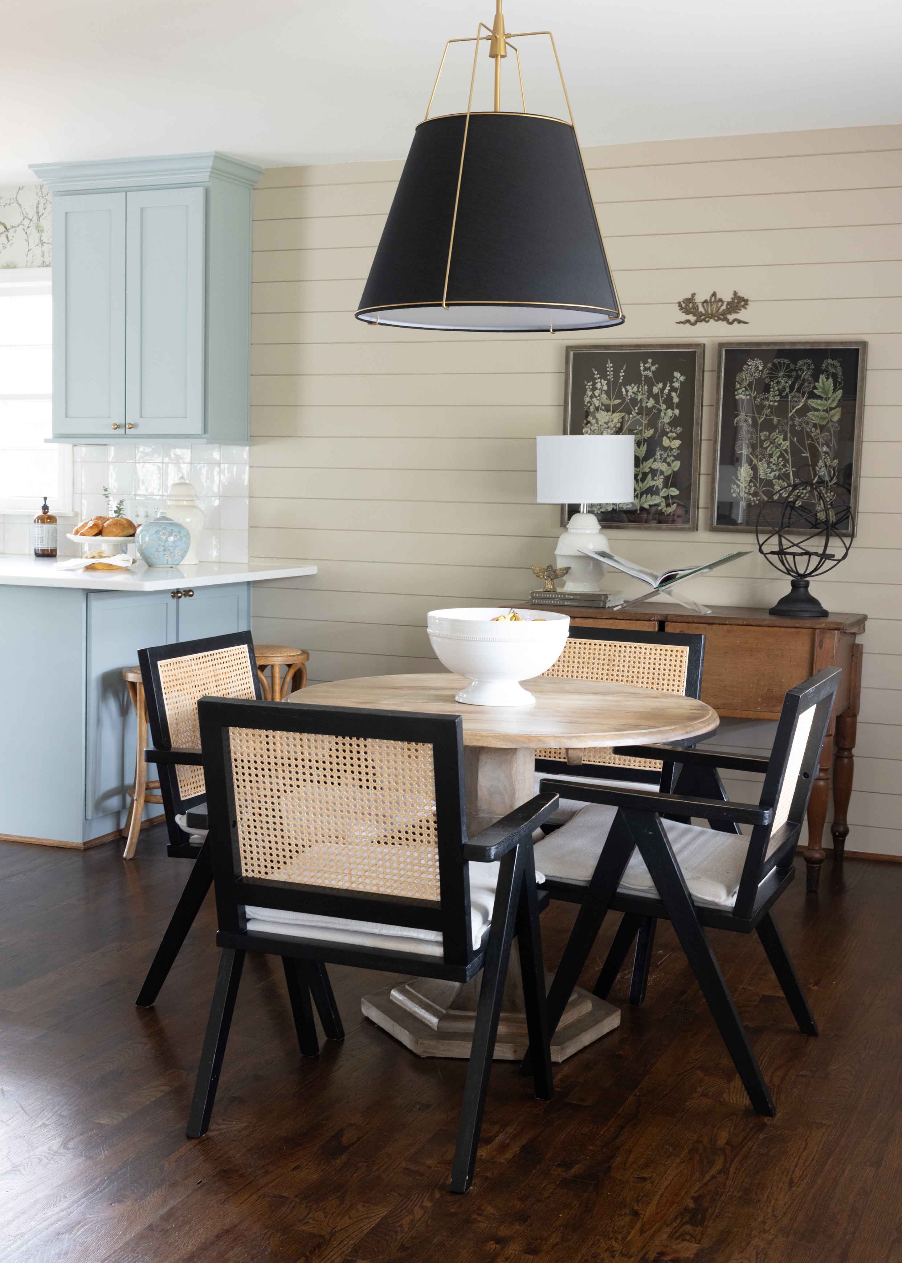 Dinning Room table with black hanging lamp above