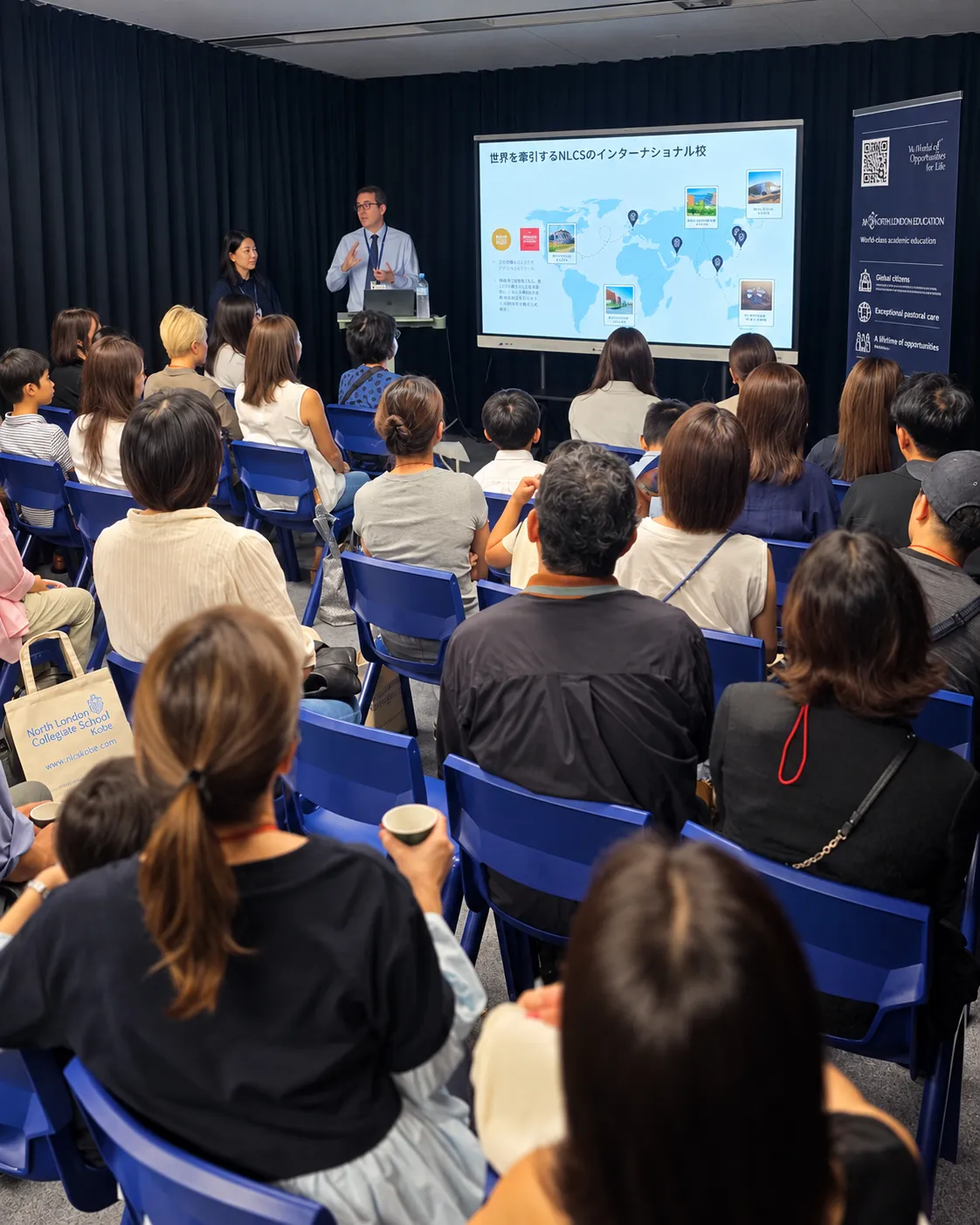 Parents and children attending a school introduction at an NLCS Kobe Open Day