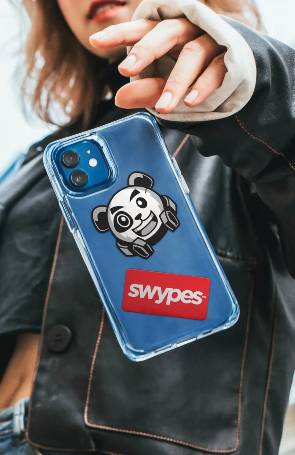 A woman holding a phone case with a panda on it.