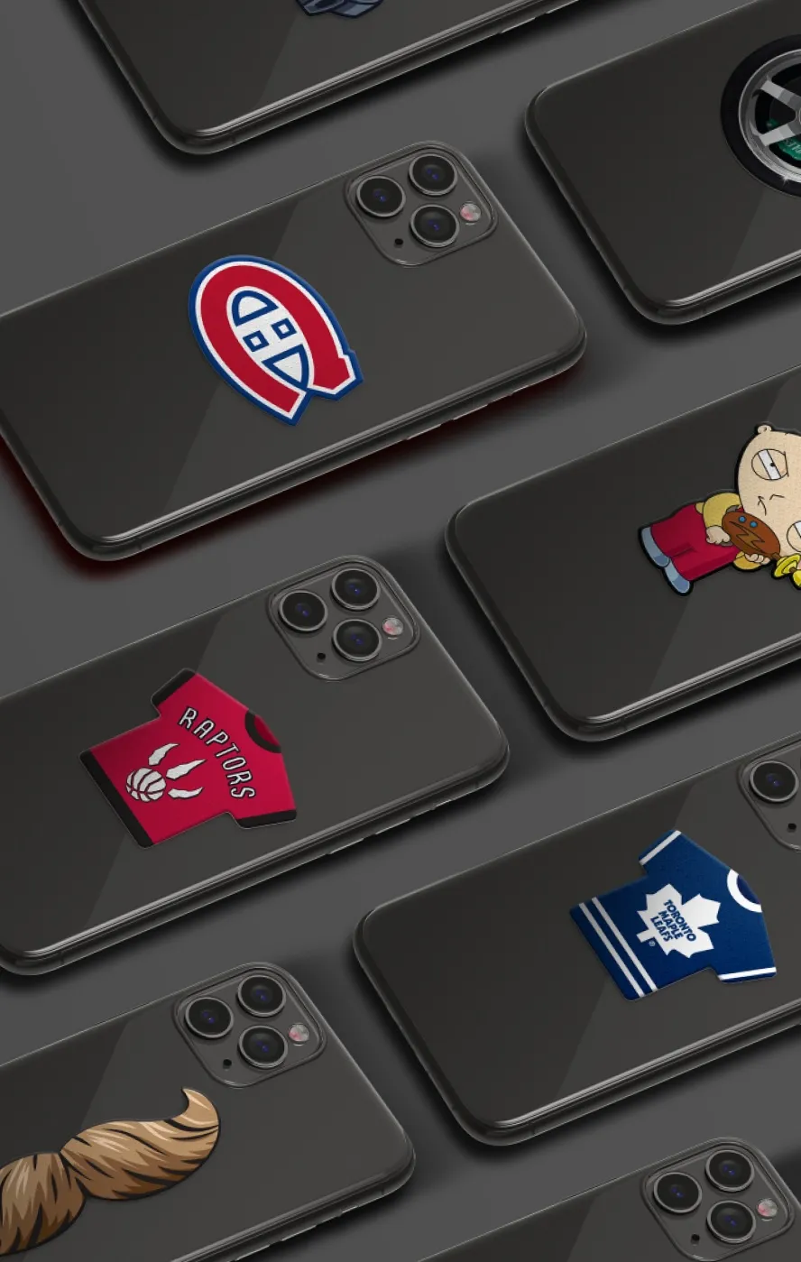 A bunch of cell phones with stickers on them.