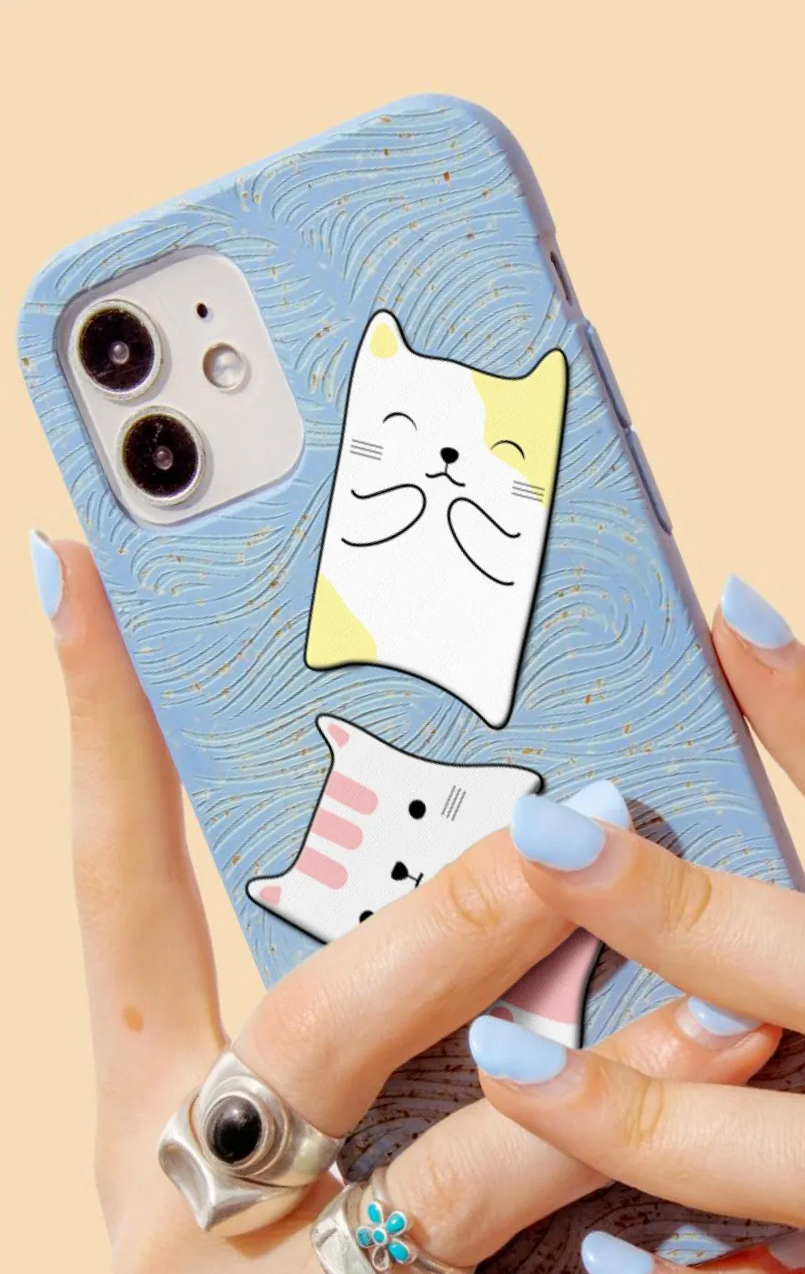 A woman holding a cell phone up to her face.