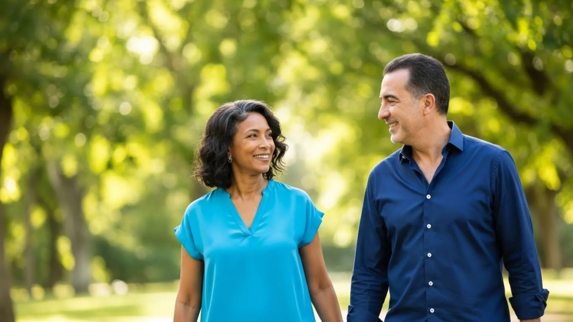 Middle-aged couple walking outdoors for longevity wellness support