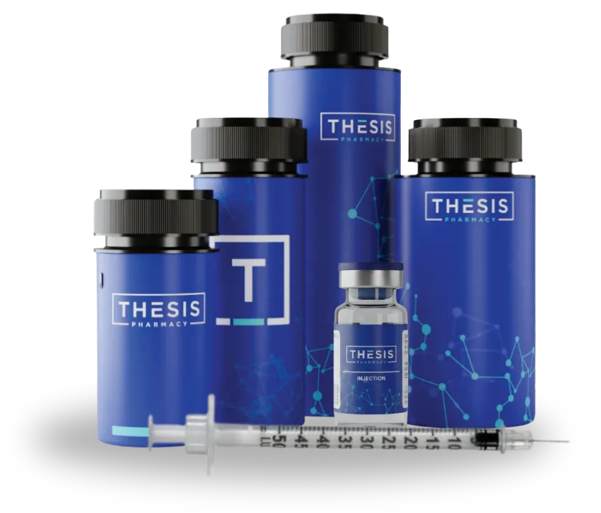 Blue bottles and vial with Thesis Pharmacy labels and a syringe in front.