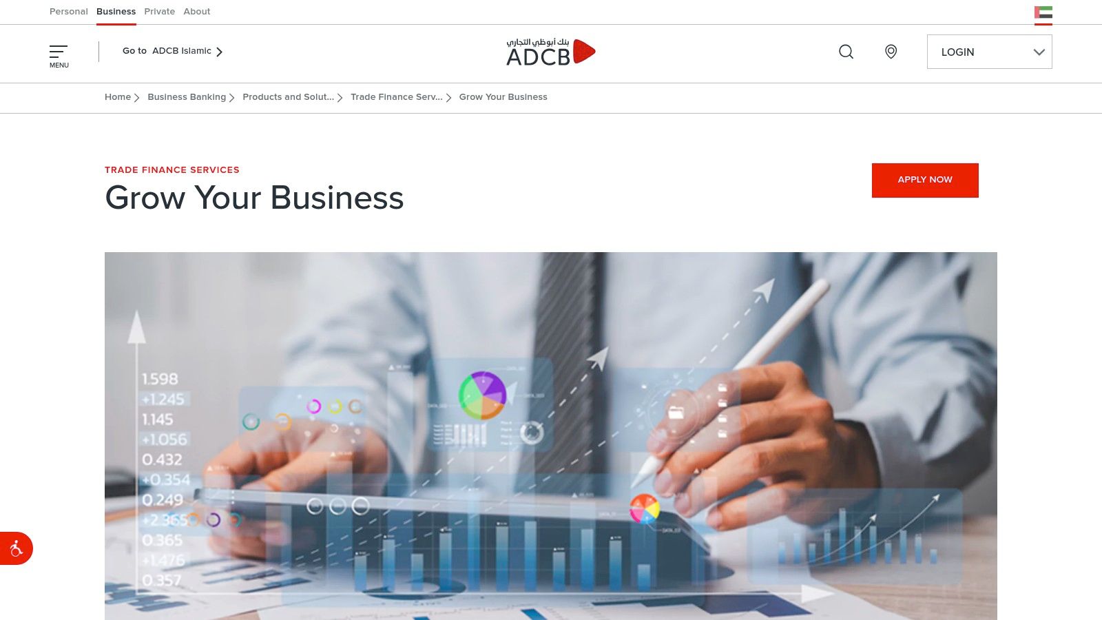 A business professional analysing financial charts and data on a tablet.