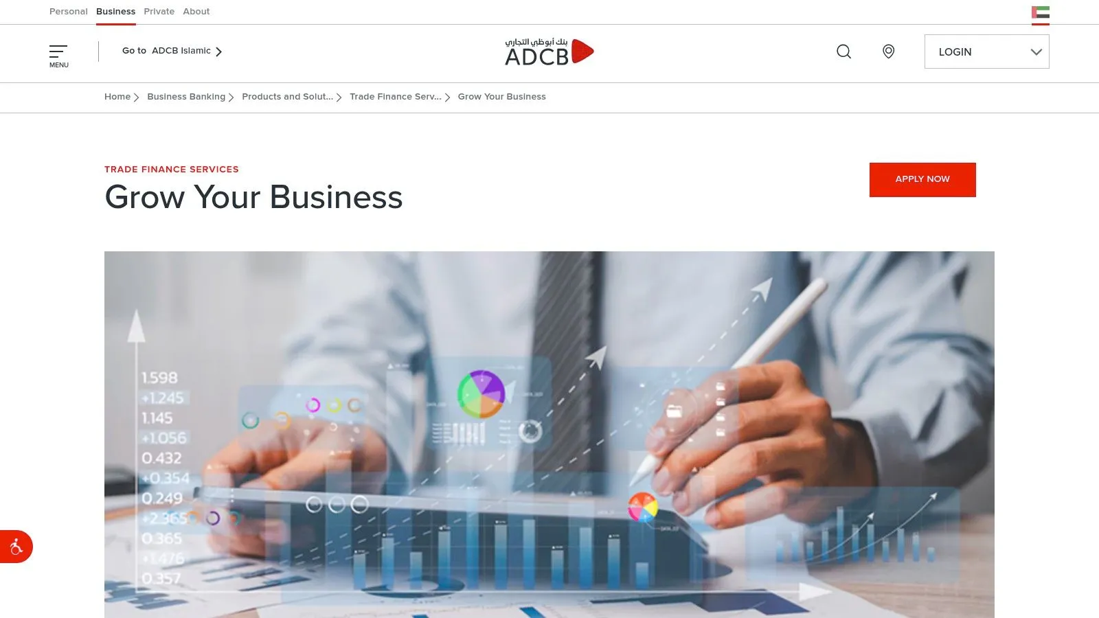 A business professional analysing financial charts and data on a tablet.