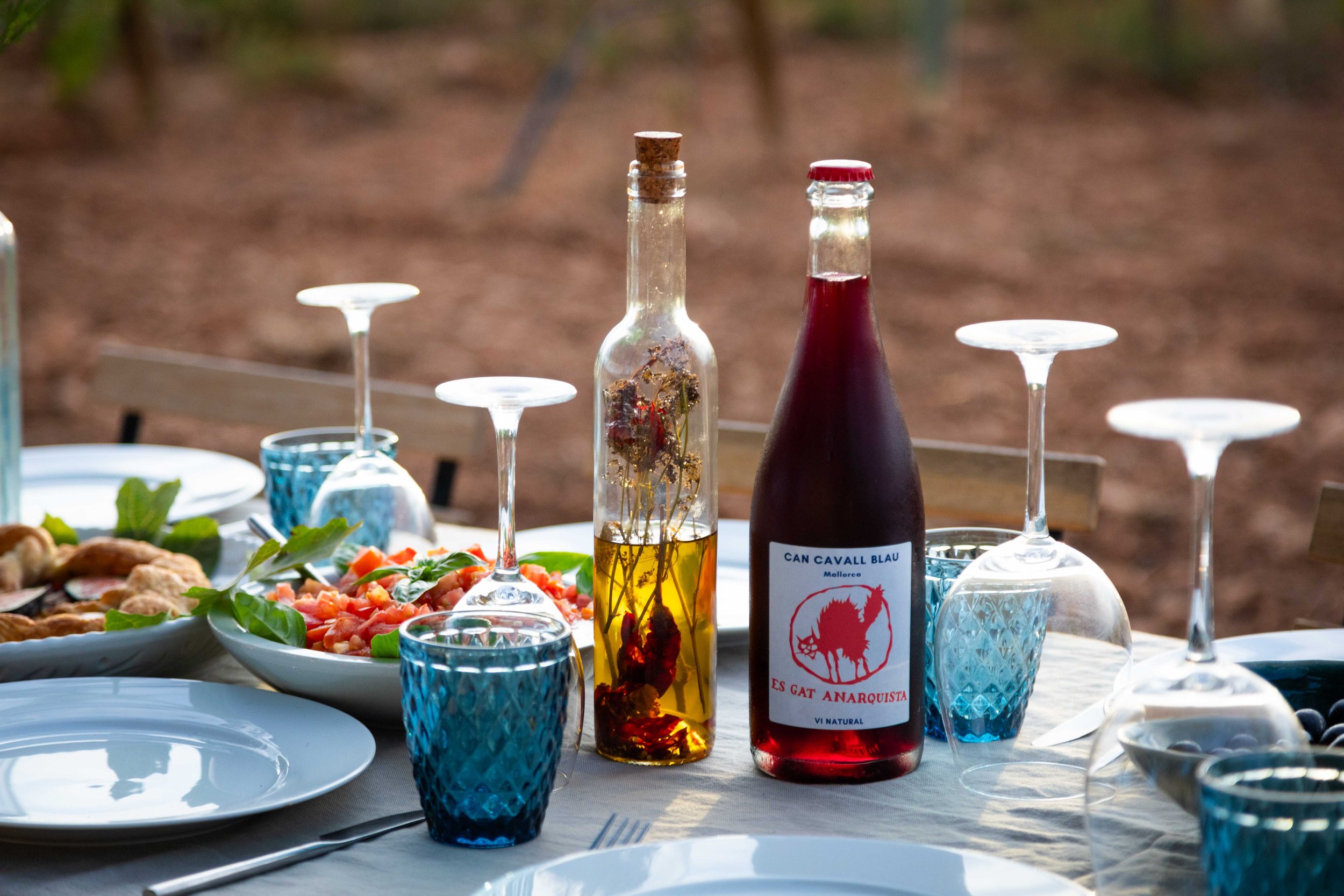 An elegantly set long-table dinner on the terrace at Can Cavall Blau