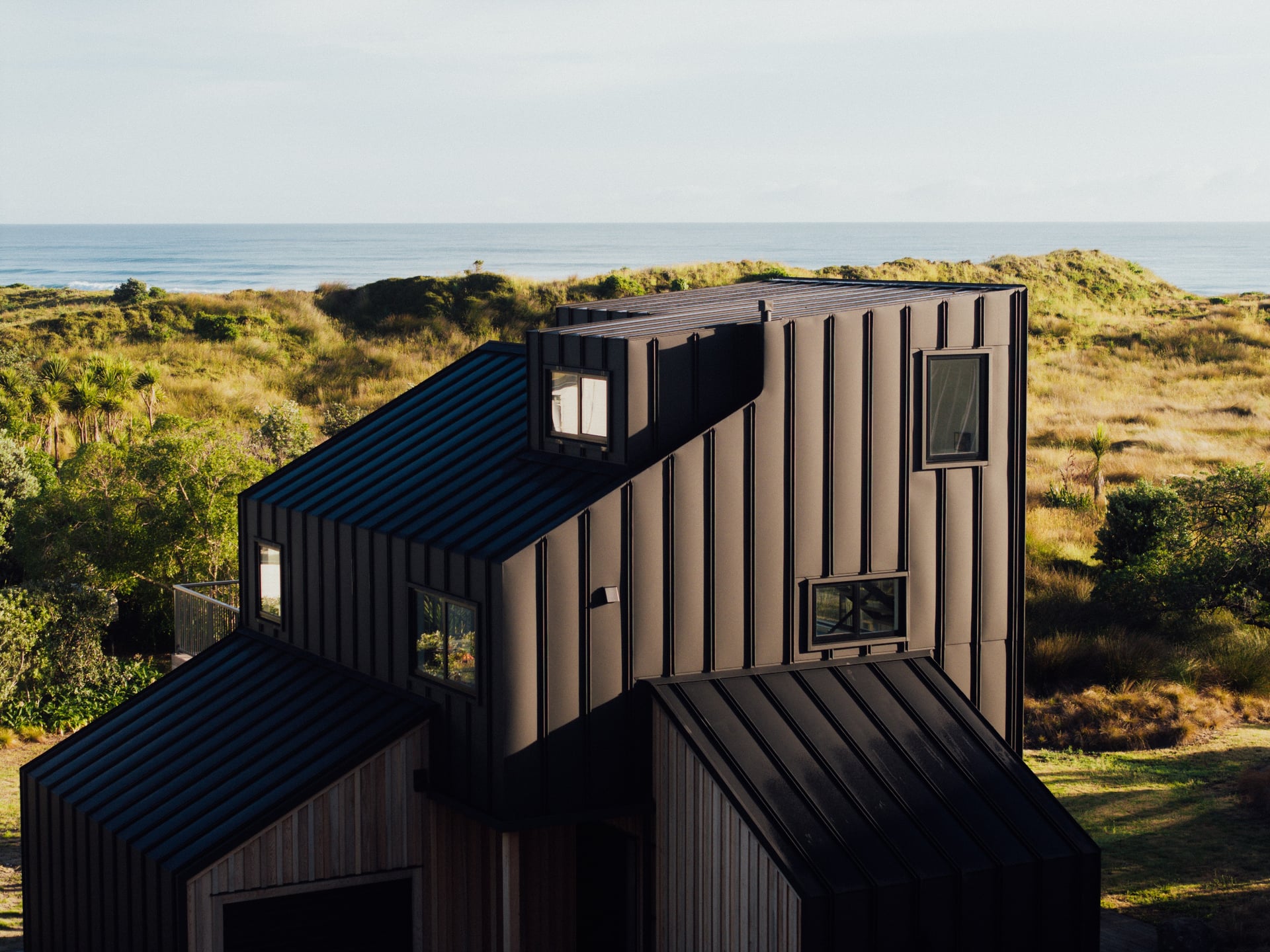 Coastal architectural exterior with ocean view, by Onsite Media