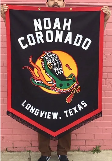 Person holding a black and red banner with a stylized crocodile head, text reading "Noah Coronado" above and "Longview, Texas" below.