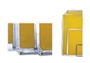 Three yellow and silver metal clamps or holders in a row with a similar larger item on the right.