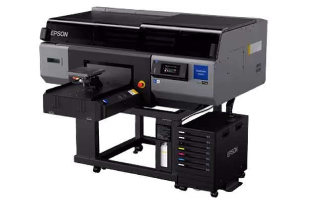 Epson SureColor large format printer with color ink cartridges visible on the right side.