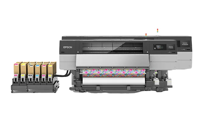 Epson SureColor F11000 textile printer with six ink cartridges and vibrant floral fabric printing.