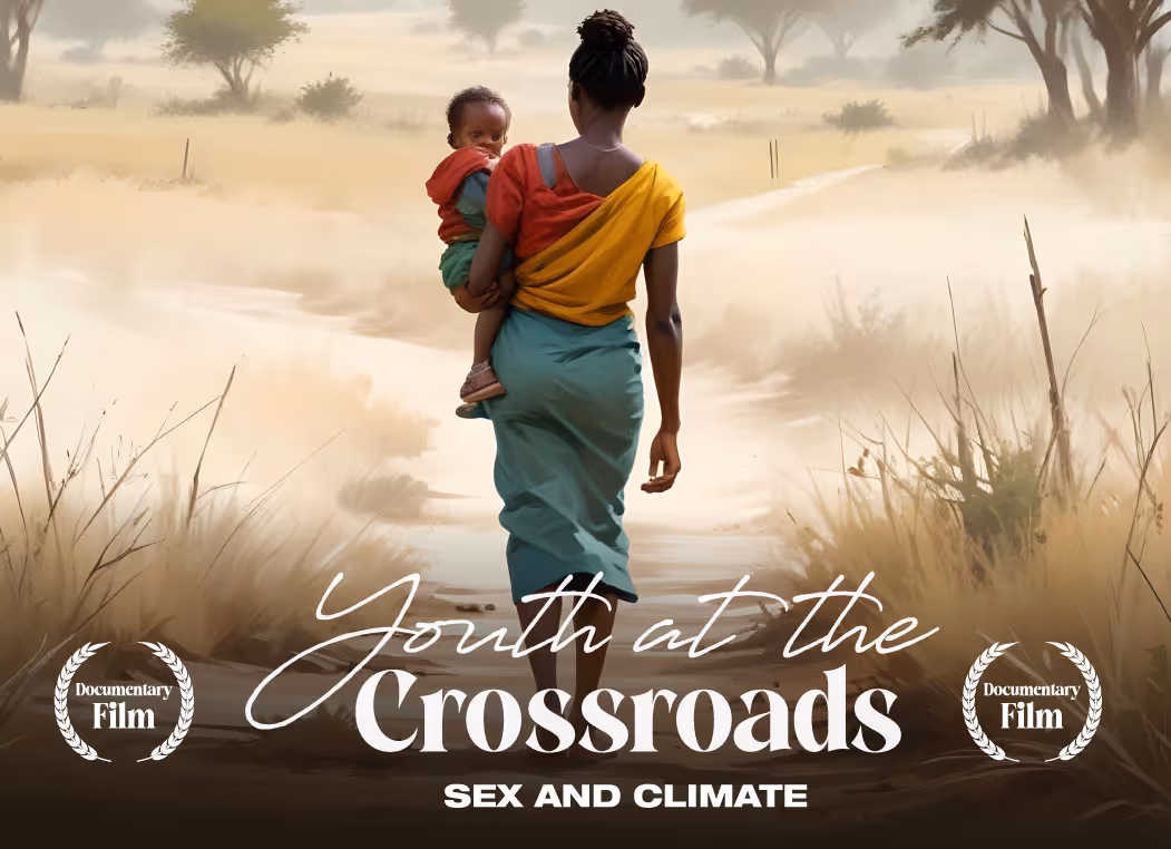 Woman walking on dusty path carrying child, text reads 'Youth at the Crossroads: Sex and Climate'.
