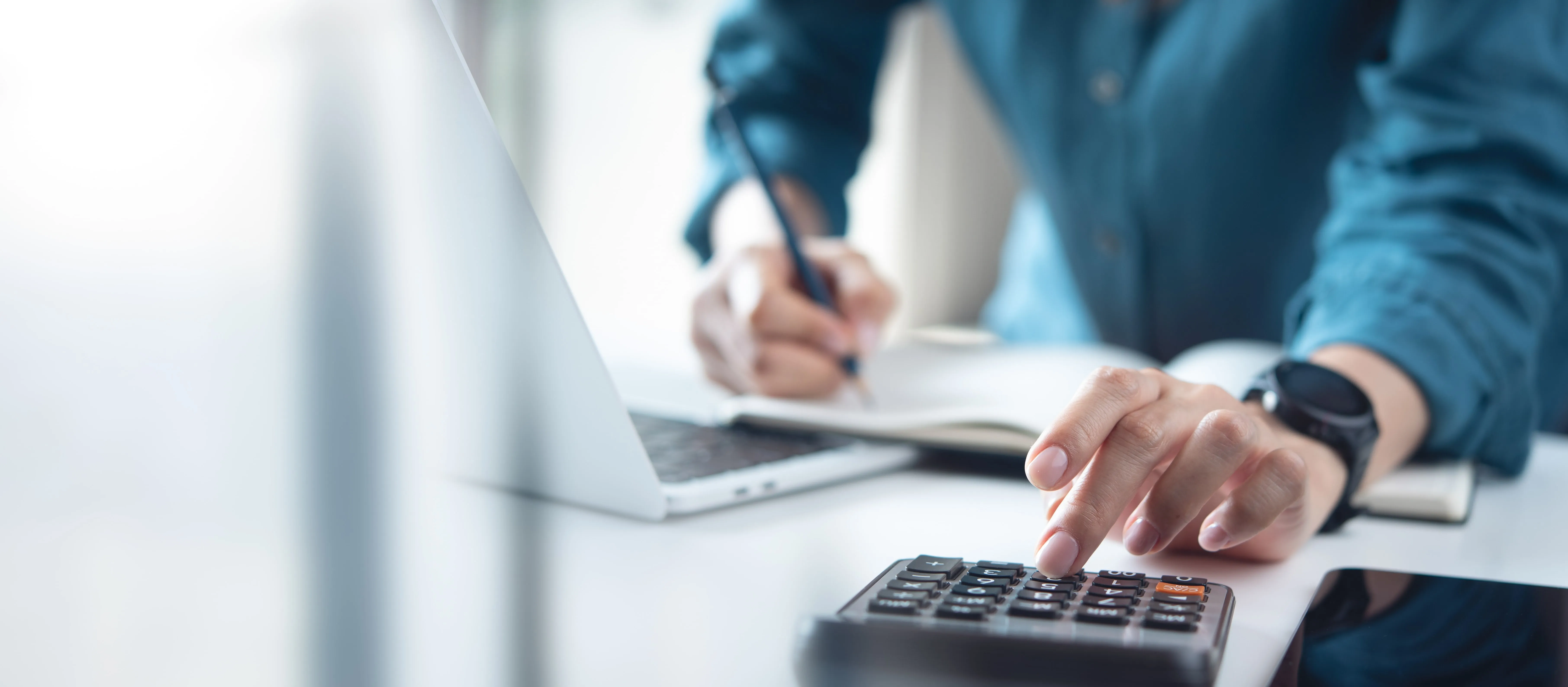 a man making calculations on the calculator