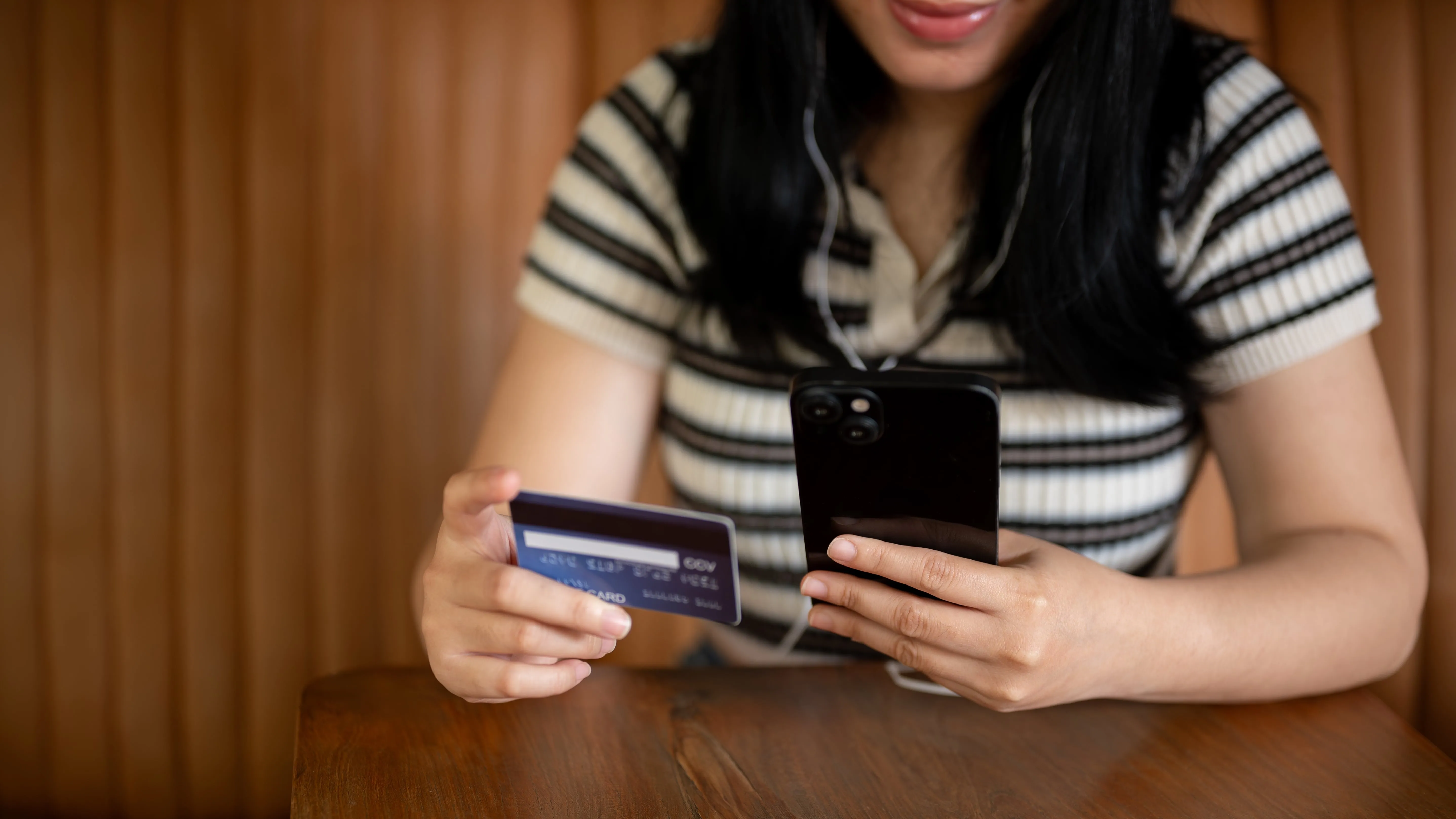 a woman checking her card details
