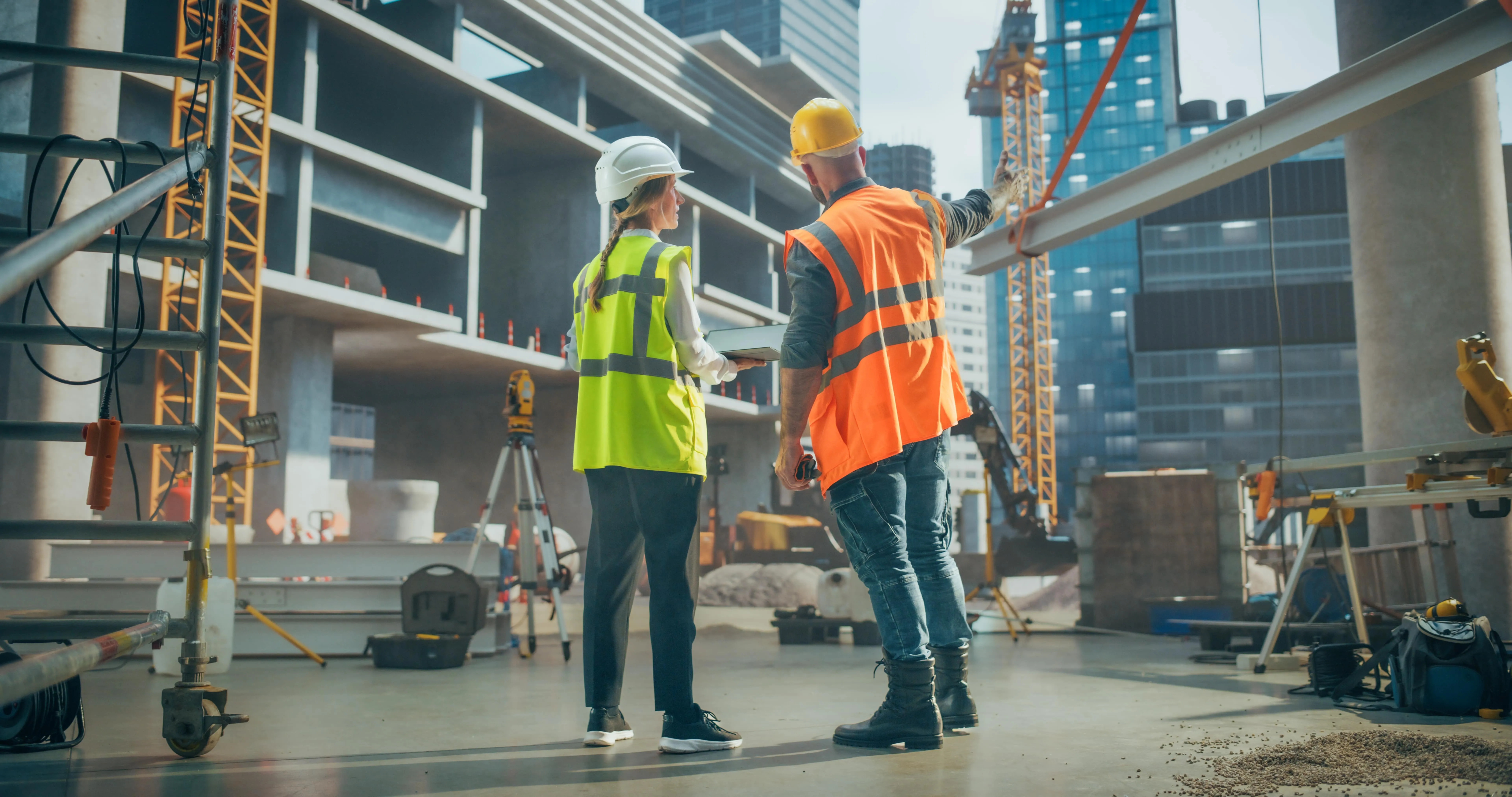 two workers looking at the construction site