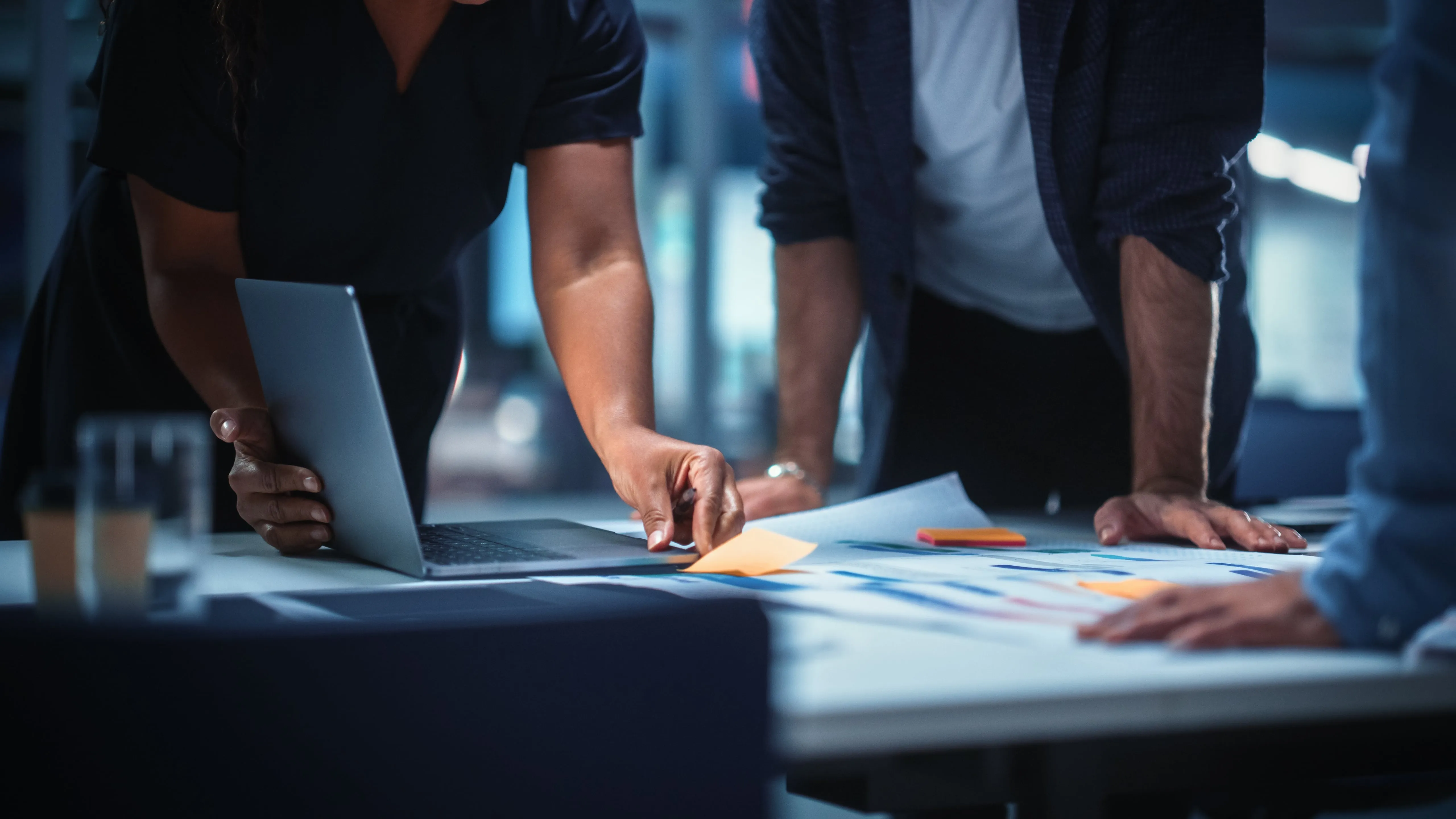 a close-up of two people looking at data