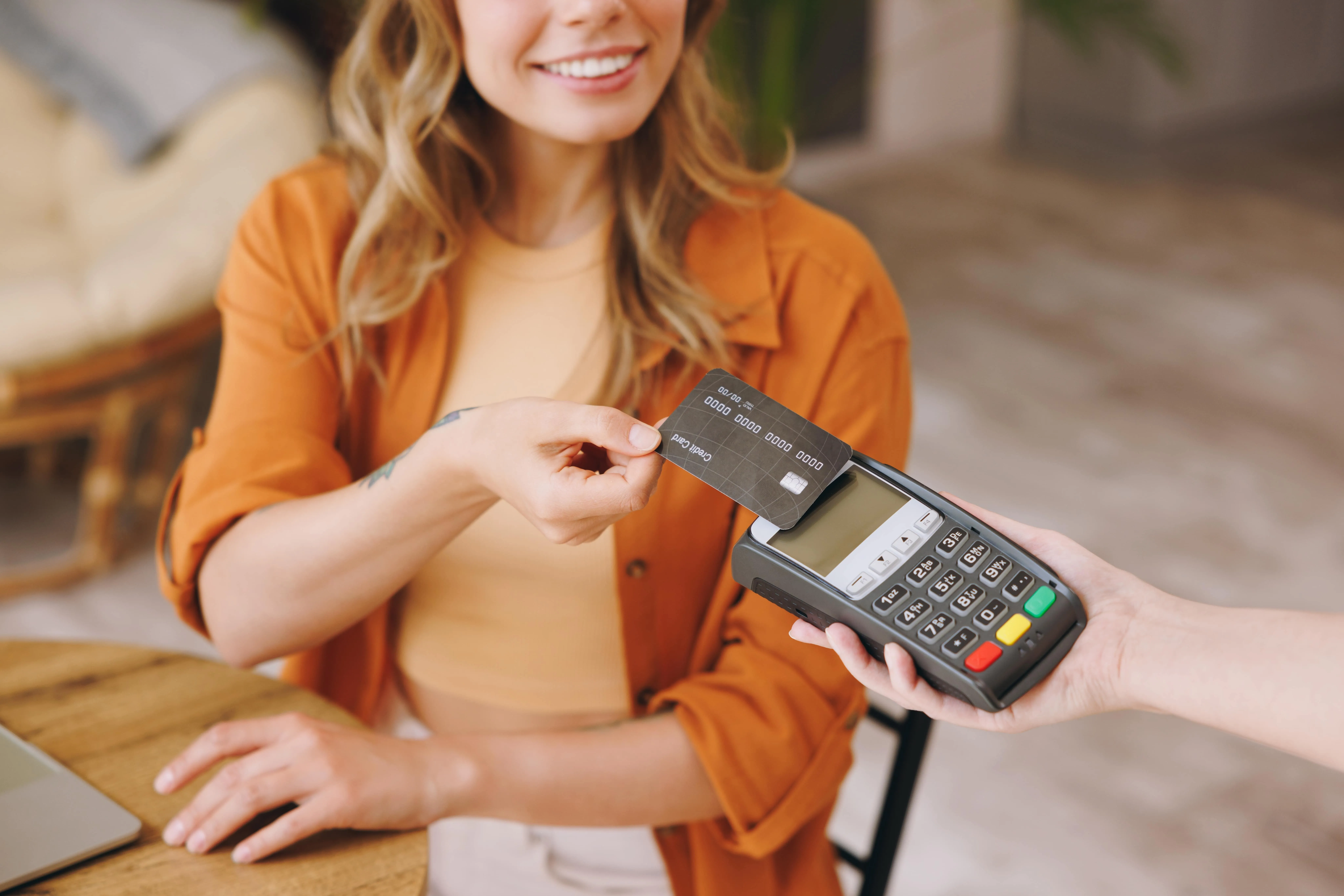 a woman paying via card