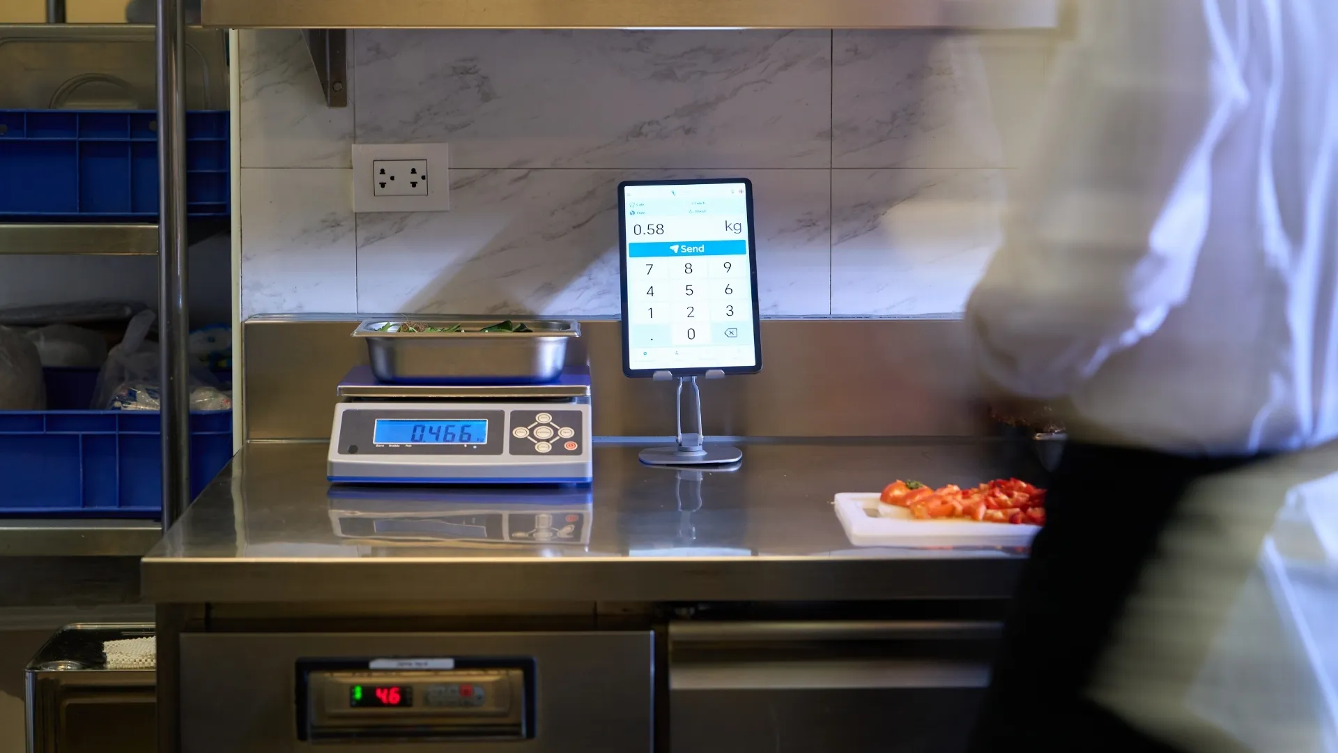A clean digital analytics dashboard displaying color-coded bar graphs tracking food waste per cover metrics against a baseline
