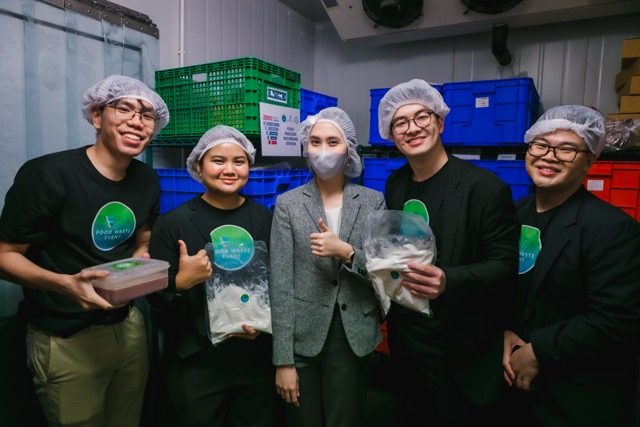 Lightblue consultants working alongside chefs in the high-pressure back kitchen of the Michelin Star Revelation, monitoring food recording stations and ensuring surplus food is safely stored for redistribution.