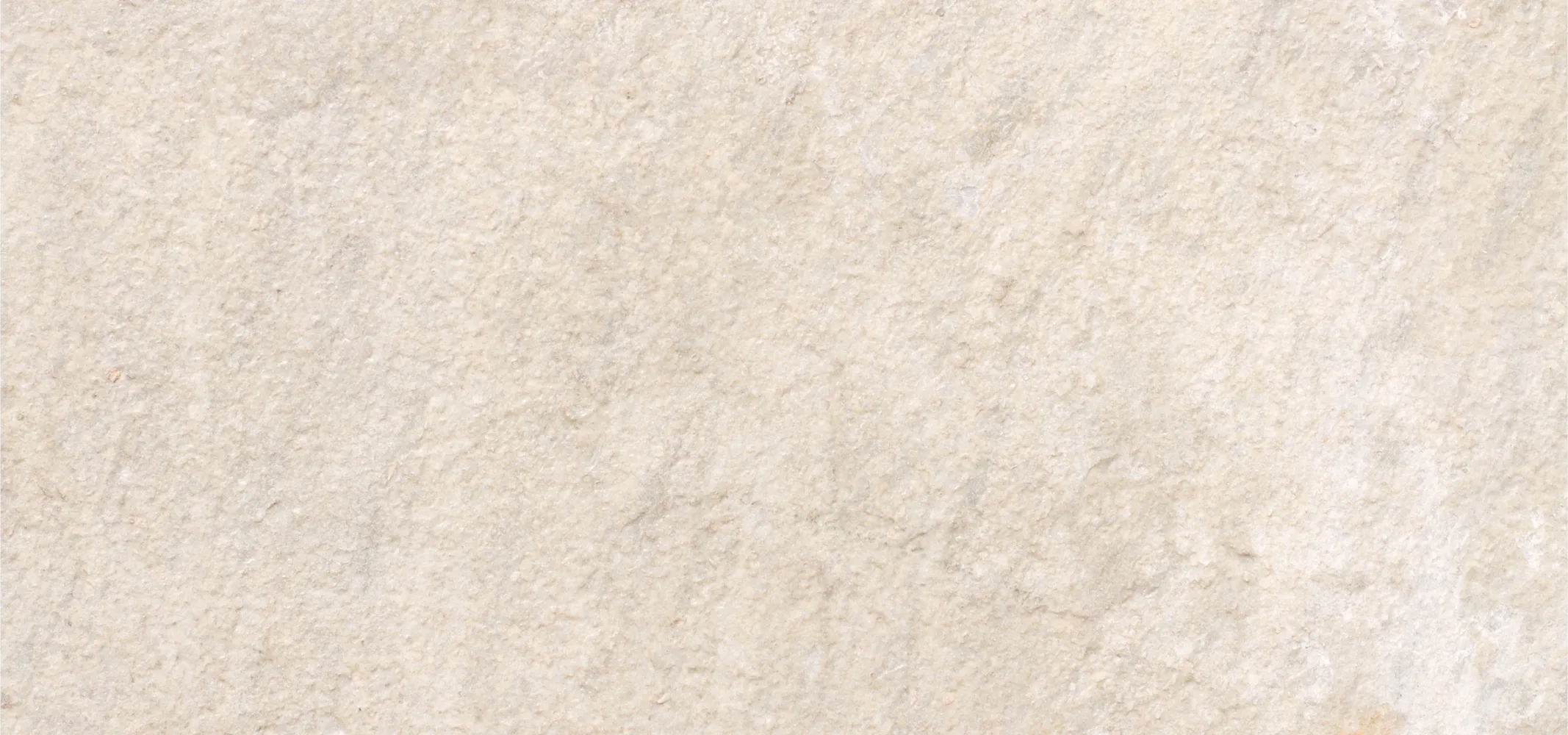 A close up of a white marble surface.