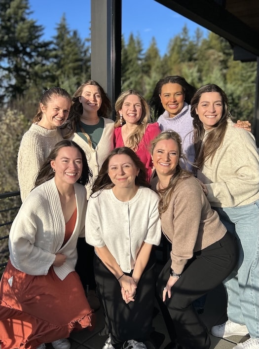 A group of women pose for a group photo.