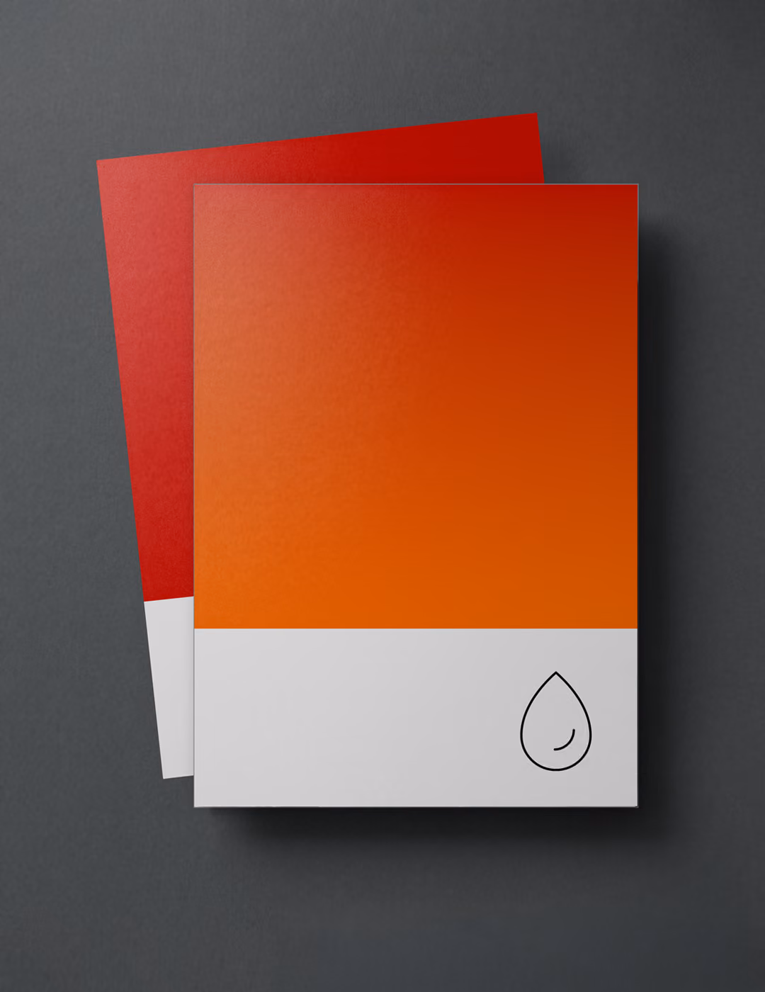 Two color swatches on a dark gray surface, one red underneath and one orange on top with a small black outlined droplet icon in the bottom right corner.