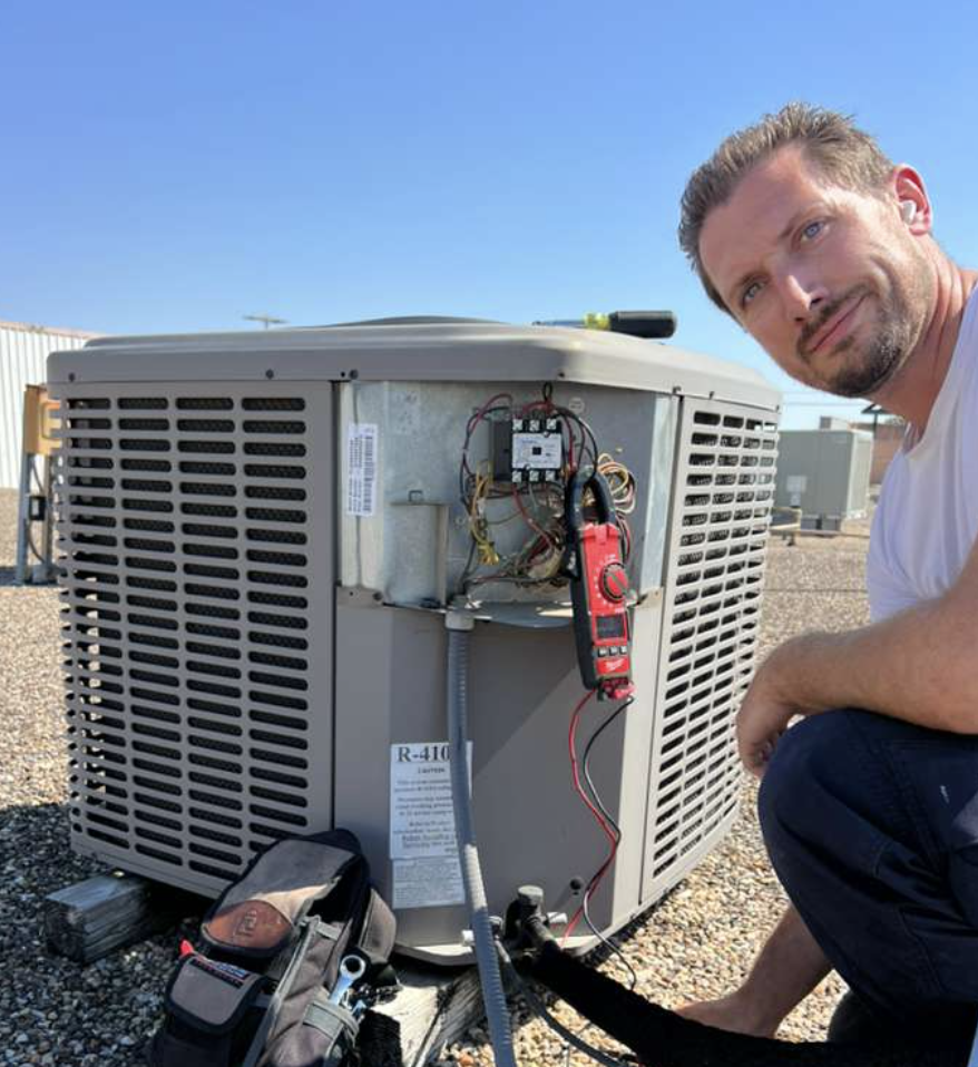 Furnace repair technician troubleshooting a home heating system on a cold winter day