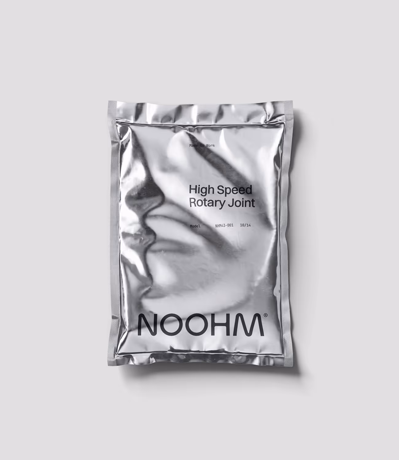 Glanzende zilverkleurige verpakking met de tekst ‘High Speed Rotary Joint’ en het Noohm-logo in zwart onderaan.