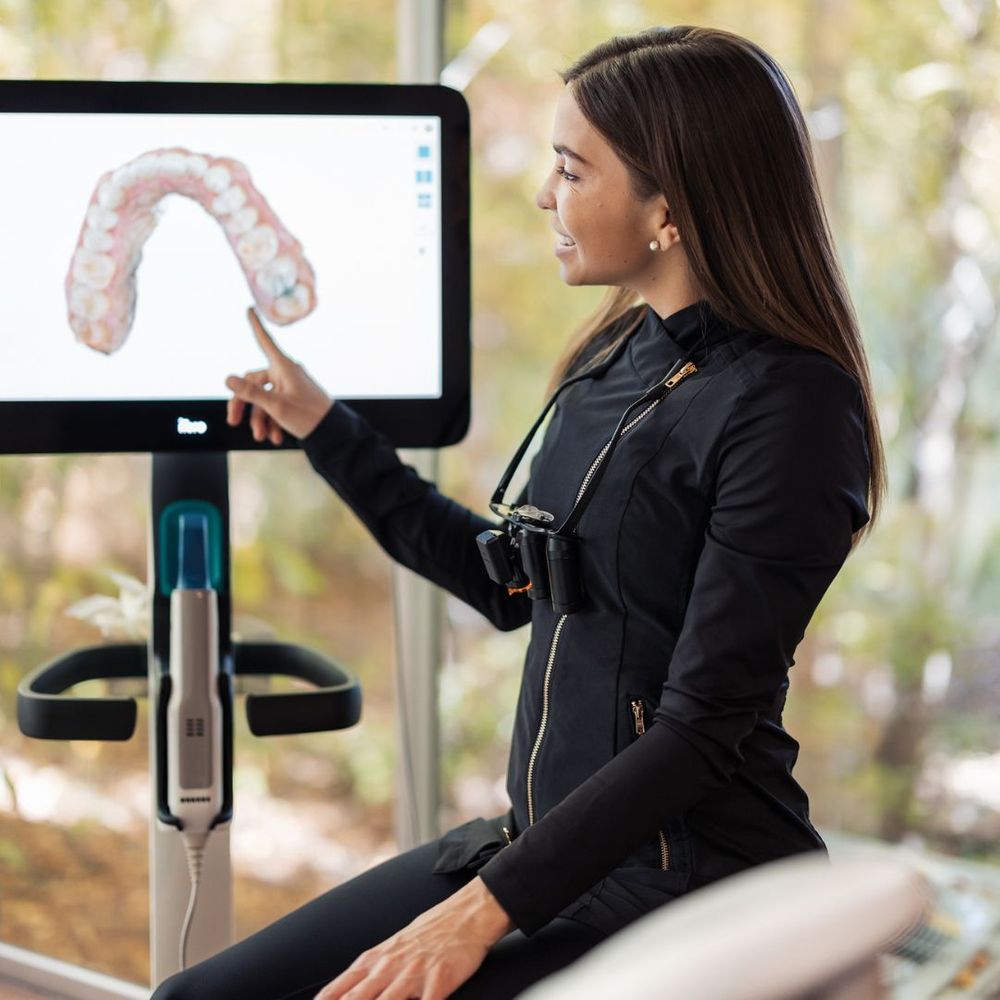 dentist pointing to screen