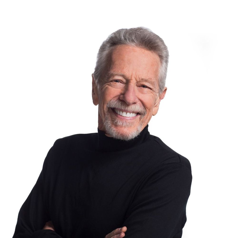 Man with veneers smiling and looking happy. 