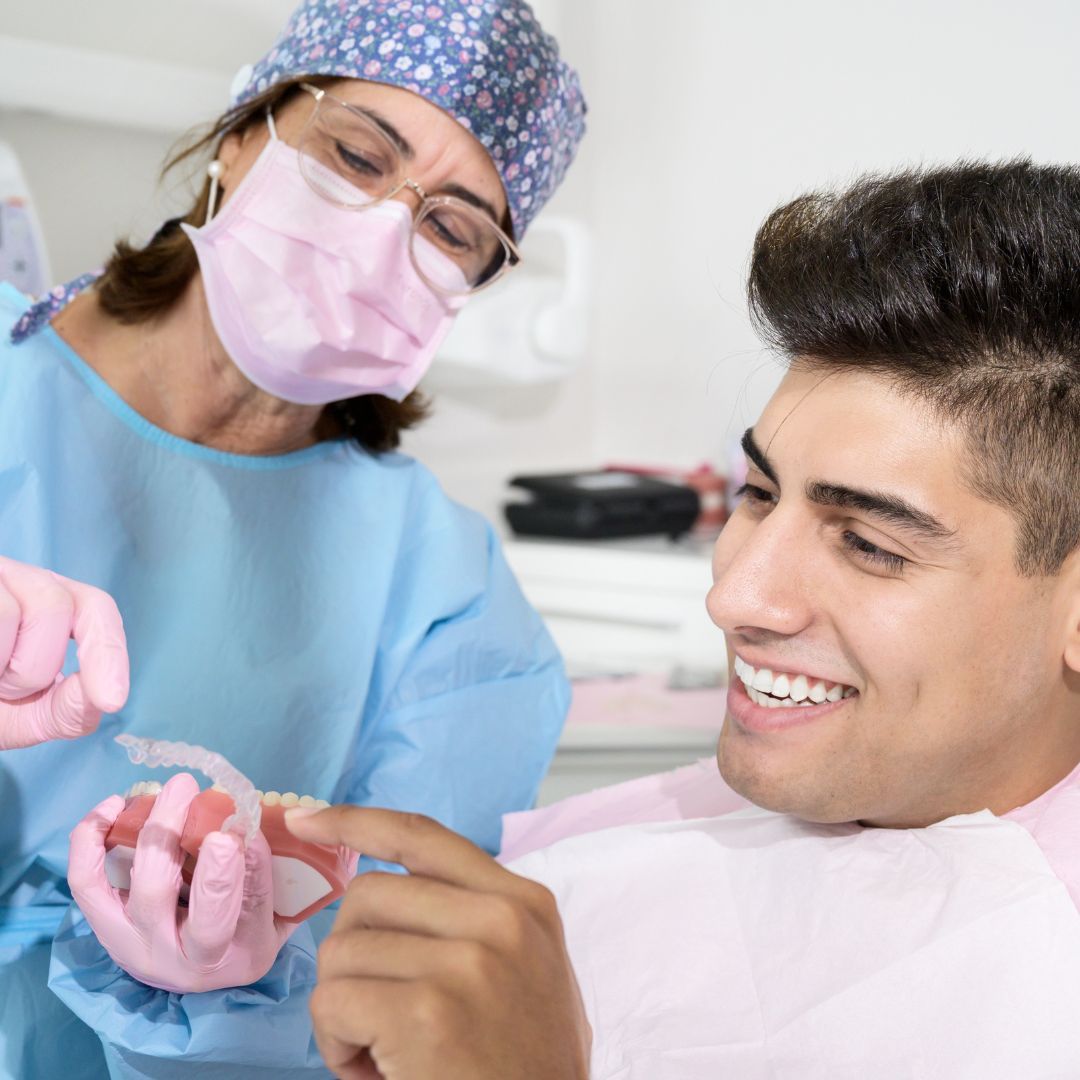 doctor showing patient invisilign trays