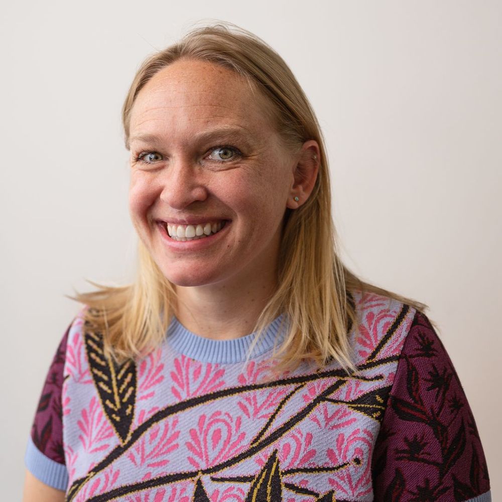 Woman with perfect teeth smiling confidently.