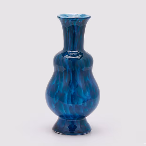 Dark blue vase on a white background