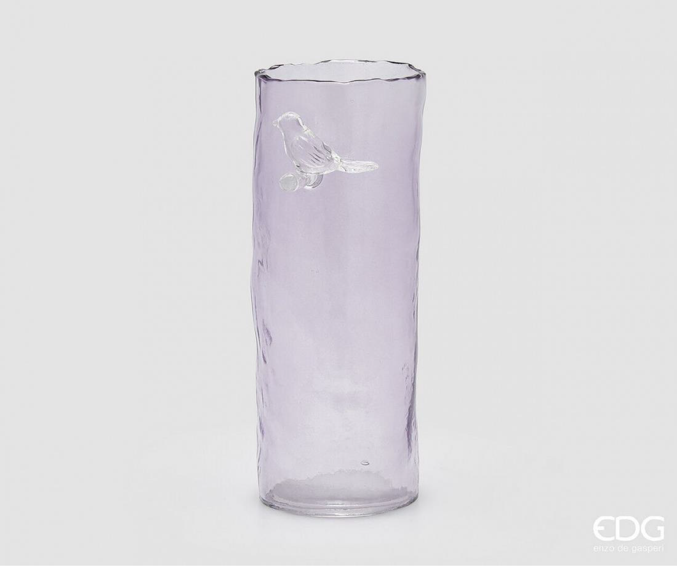 A minimal cylindrical vase in a soft lavender tone, designed to bring subtle color and lightness into the space. The clean shape is complemented by a delicate bird detail, adding a refined decorative touch without overwhelming the form. Suitable for single stems, branches, or simple arrangements, it works well in both modern and natural interiors.