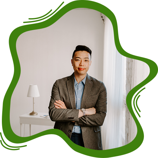 Professional portrait of a male real estate attorney in a blazer with arms crossed.