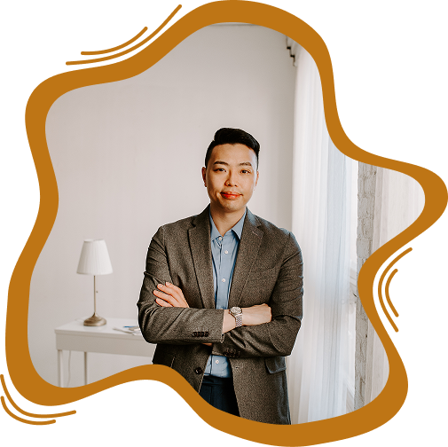 Professional portrait of a male estate planning attorney in a blazer with arms crossed.
