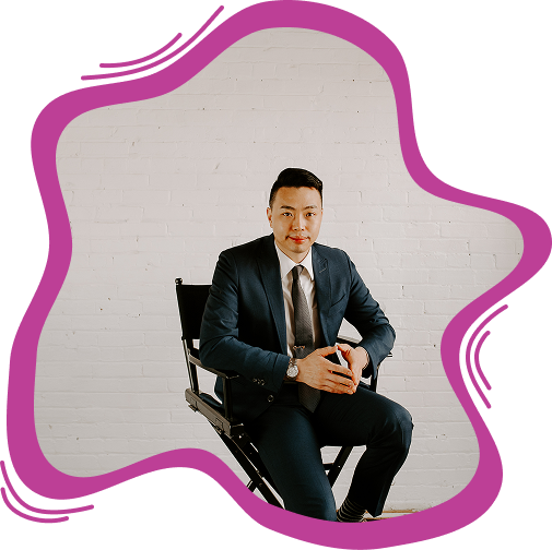 Professional portrait of a male personal injury attorney in a dark suit and tie sitting in a chair.