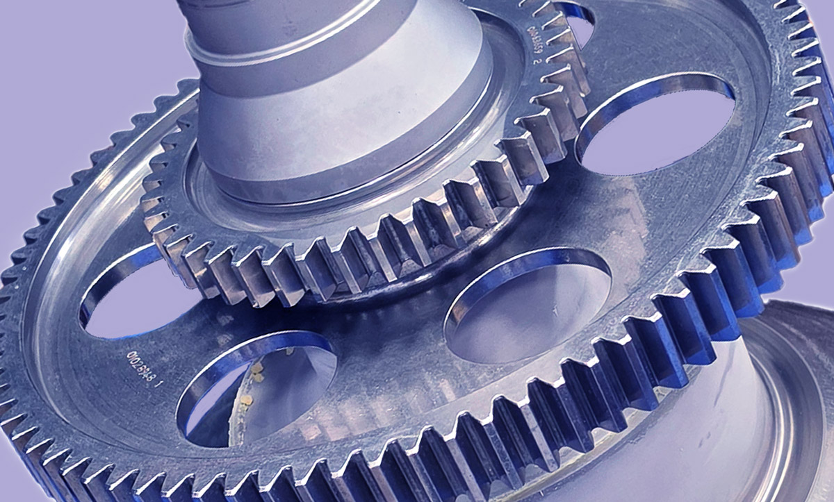Close-up of precision-machined steel gears produced to tight engineering tolerances.