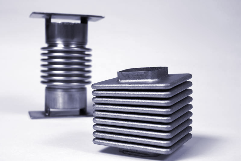 An image of two different metal bellows