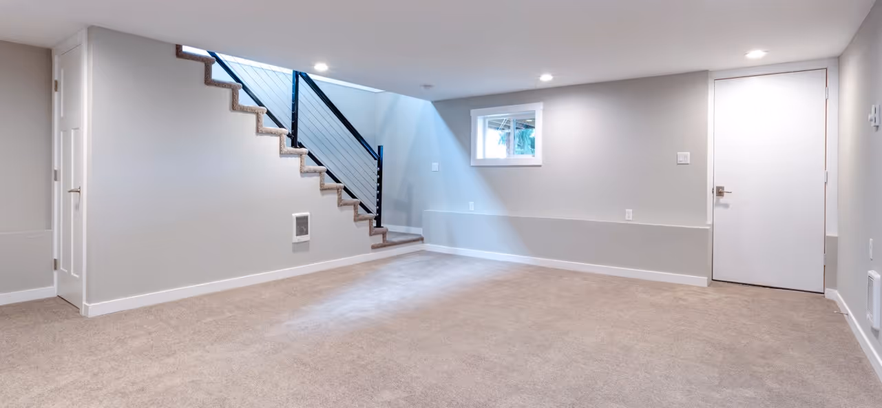 Beige carpet in finished basement by James River Flooring Richmond VA metro residential installers