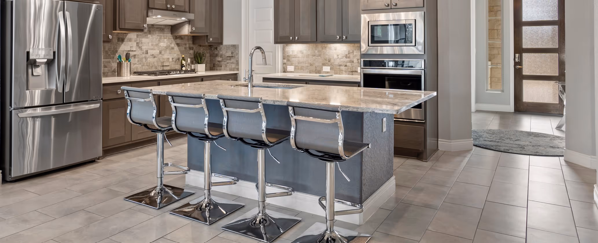 Gray tile flooring in modern kitchen by James River Flooring Richmond VA metro area installers