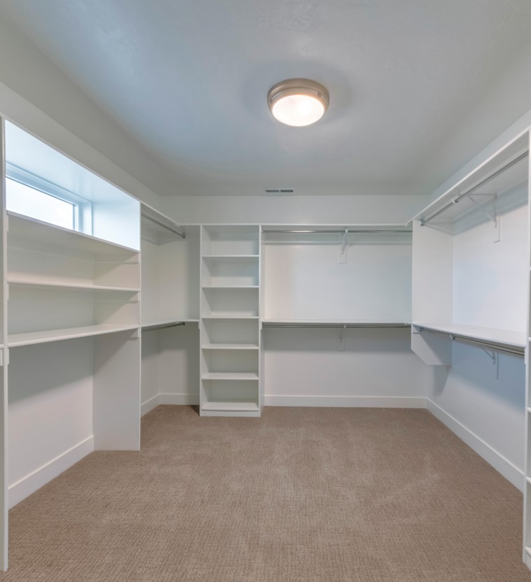 Experienced closet carpet installation in neutral tan showing cozy appearance for Petersburg VA homeowners